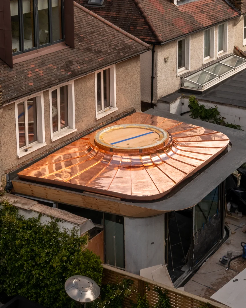 Metal Roofing and Cladding London - copper roof with circular rooflight